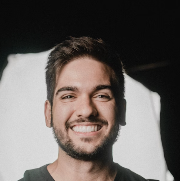 Smiling man with dark background